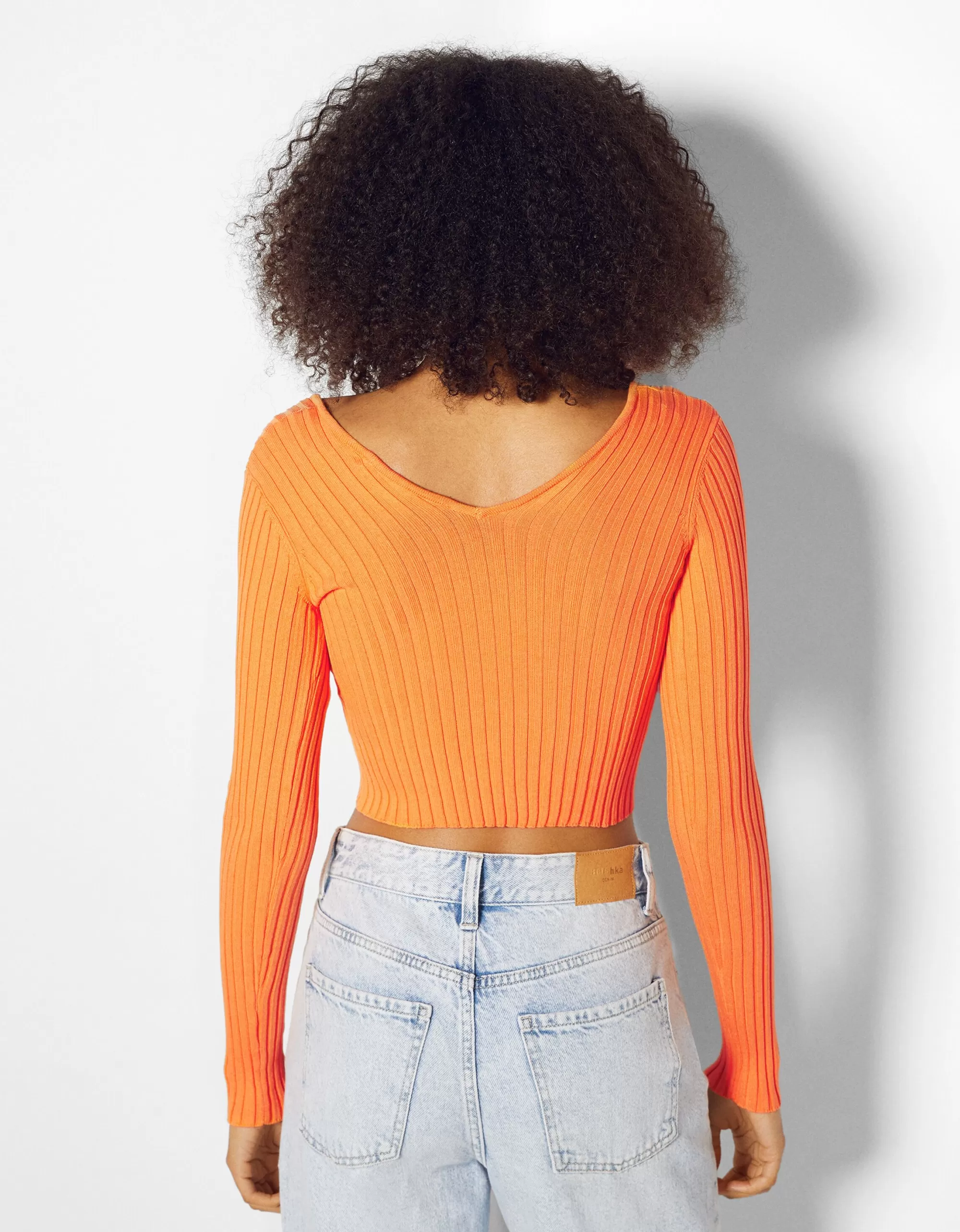 MUJER BERSHKA Jersey cuello pico rib