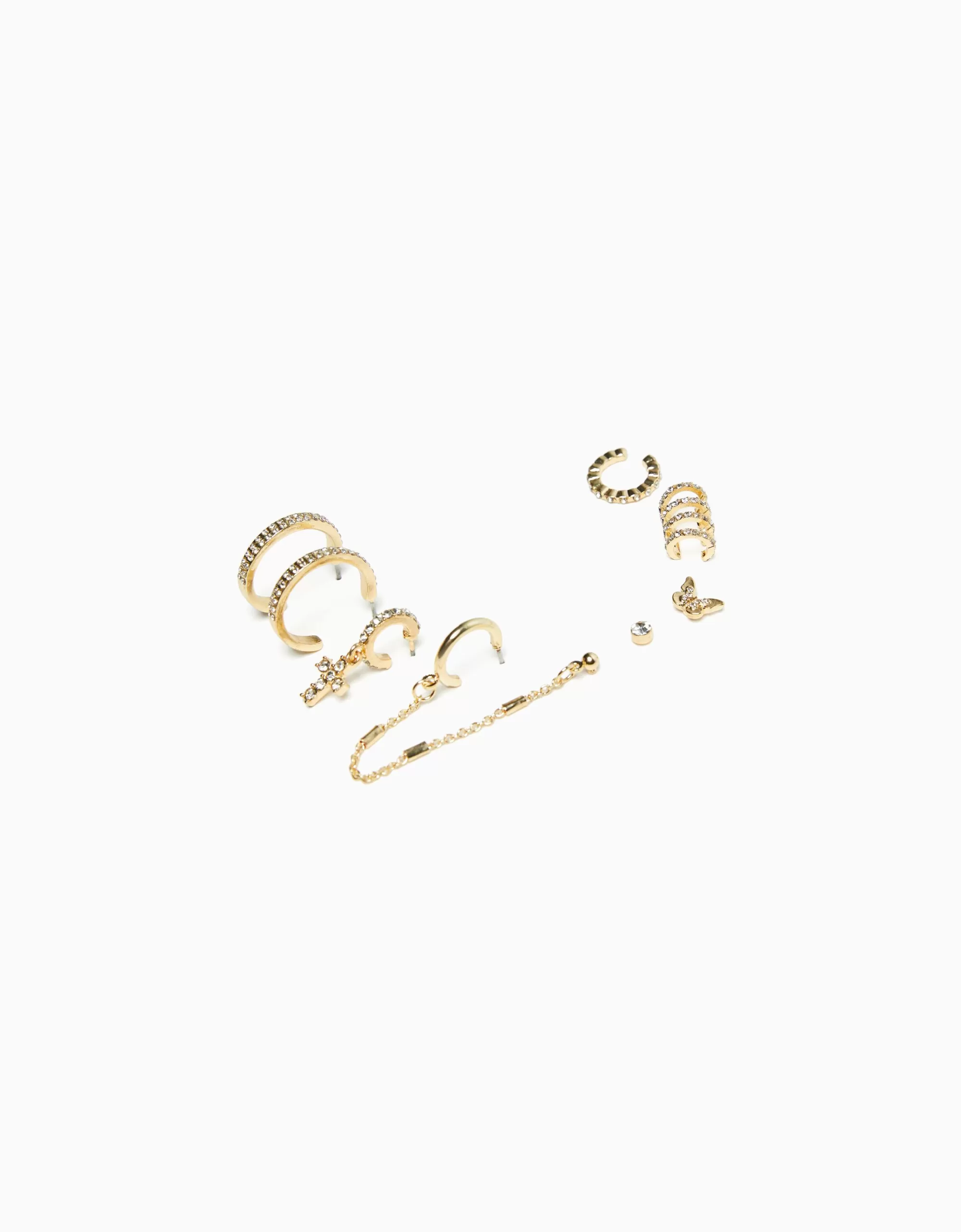 MUJER BERSHKA Set 8 pendientes aros ear cuff pedrería cruz