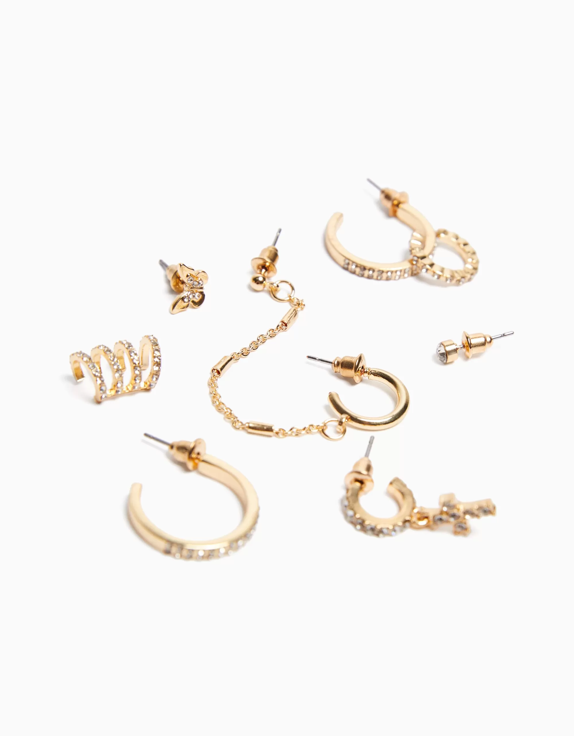 MUJER BERSHKA Set 8 pendientes aros ear cuff pedrería cruz